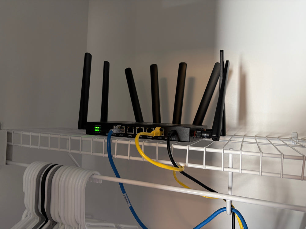 ConnecTen business router wired into a closet network shelf for always-on backup