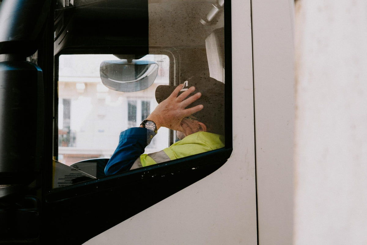 Long-haul trucker inside truck cab during a rest stop